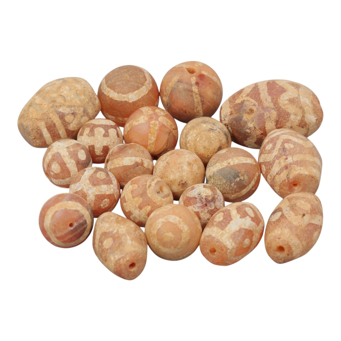 Lot of 20 Ancient Etched Carnelian Beads, Gandhara Period, 19WM: A group of 20 ancient etched carnelian beads from the Gandhara period. The beads include spherical, oval, and irregular forms, crafted primarily from reddish-orange carnelian with some lighter and wea