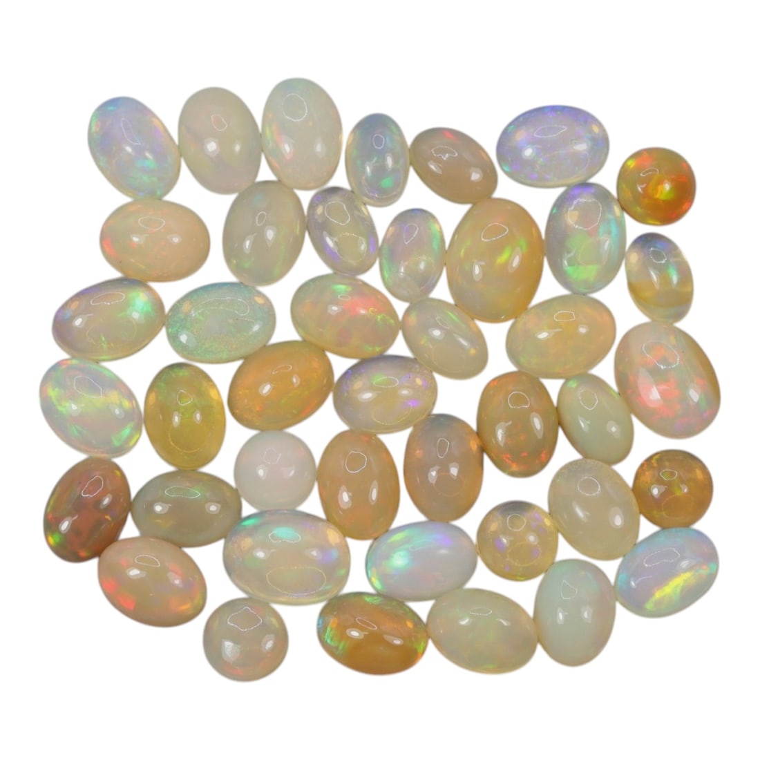 20.74 Carats Welo Opal Cabochon Parcel - Natural Ethiopian Stones, 47XA: This vibrant collection of Welo opals features a stunning variety of translucent body tones, from milky white and soft cream to warm honey and golden-orange, each adorned with vivid, shifting color pl