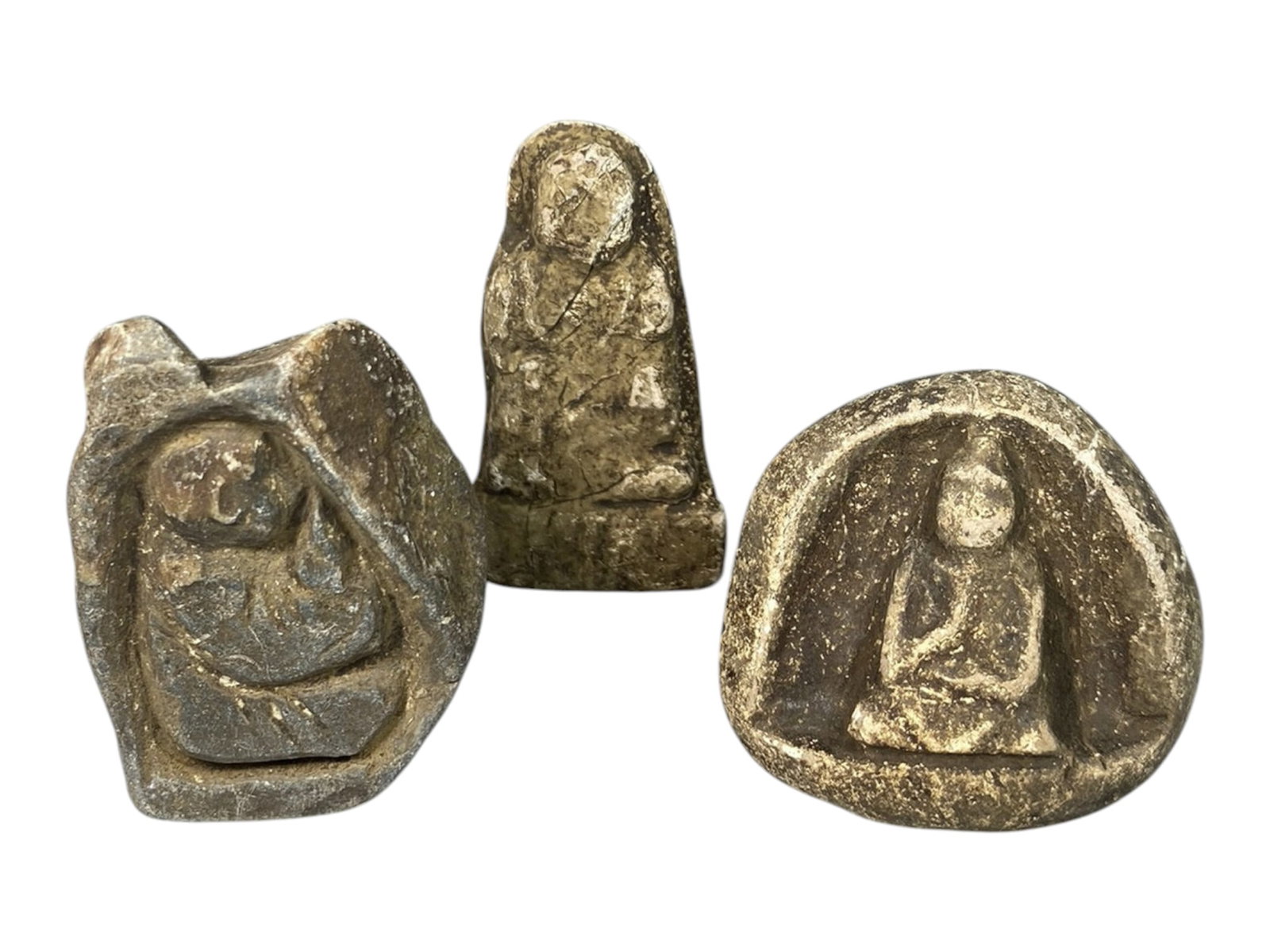 Lot of 3 Antique Japanese Edo Period Stone Buddhist Figurines, 83AG: A set of three hand-carved stone Buddhist amulets attributed to the Edo period (1603-1868), Japan. Crafted from weathered stone with earthy patination and traces of white pigment, these pieces show si