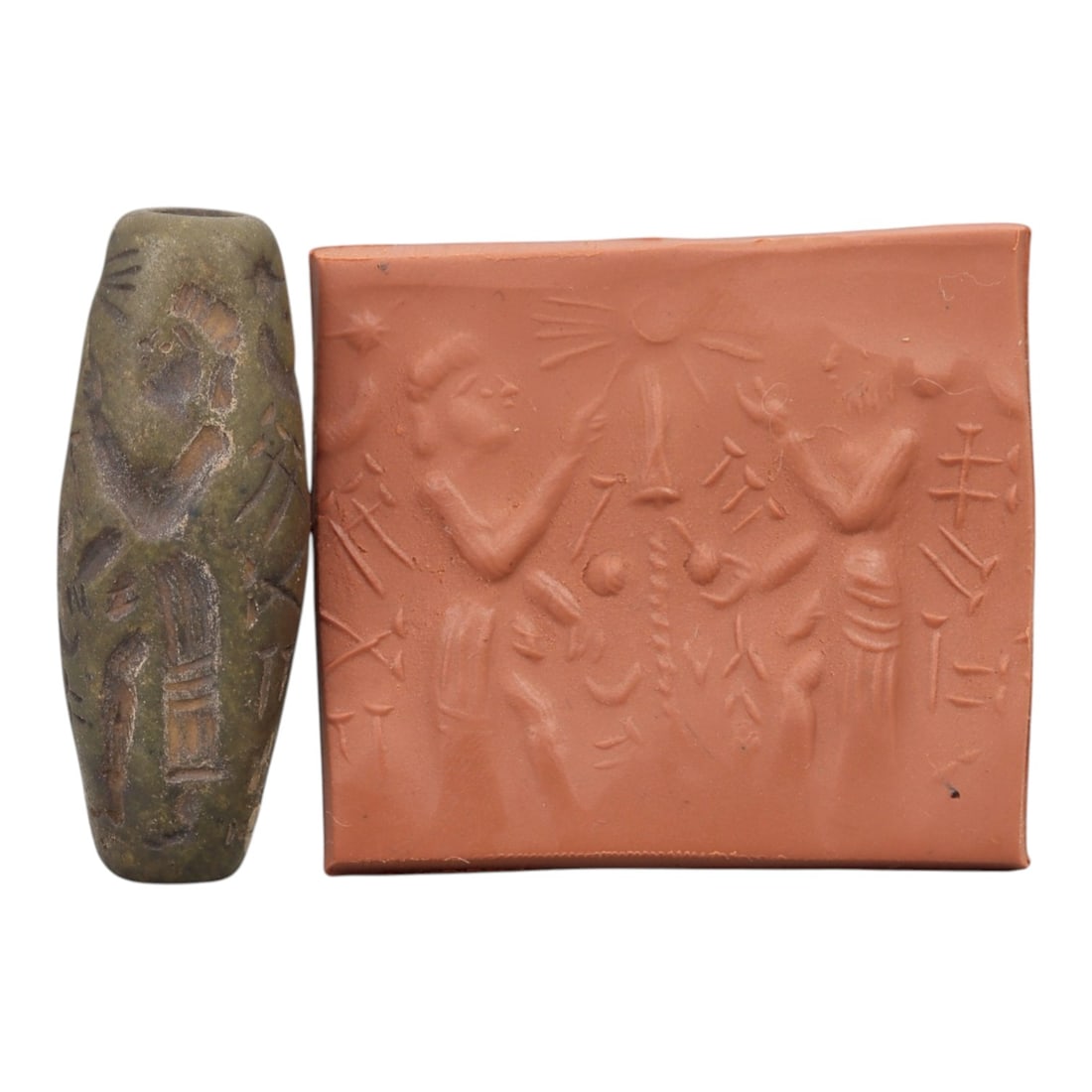 Ancient Steatite Cylinder Seal - Mesopotamian Sacred Tree & Cuneiform Scene, 60AN: Carved from dense steatite, this ancient Mesopotamian cylinder seal features a detailed linear relief composition of two human figures flanking a central sacred tree, interspersed with cuneiform inscr