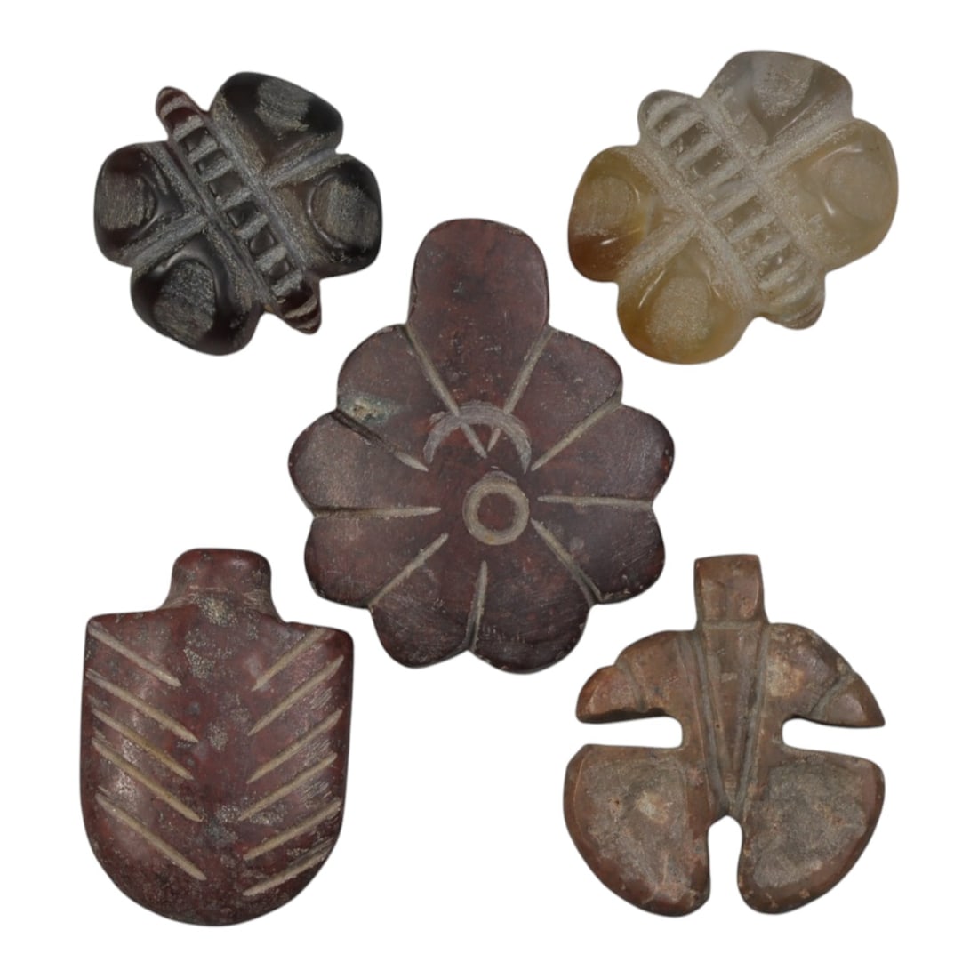 Lot of 5 Ancient Coptic Egyptian Stone Amulets, Circa Roman to Coptic Era, 91WP: Carved from various stones, including dark brown, translucent brownish-yellow, reddish-brown, and weathered brown varieties, the group consists of five distinct amulets. The set includes two cross-lik