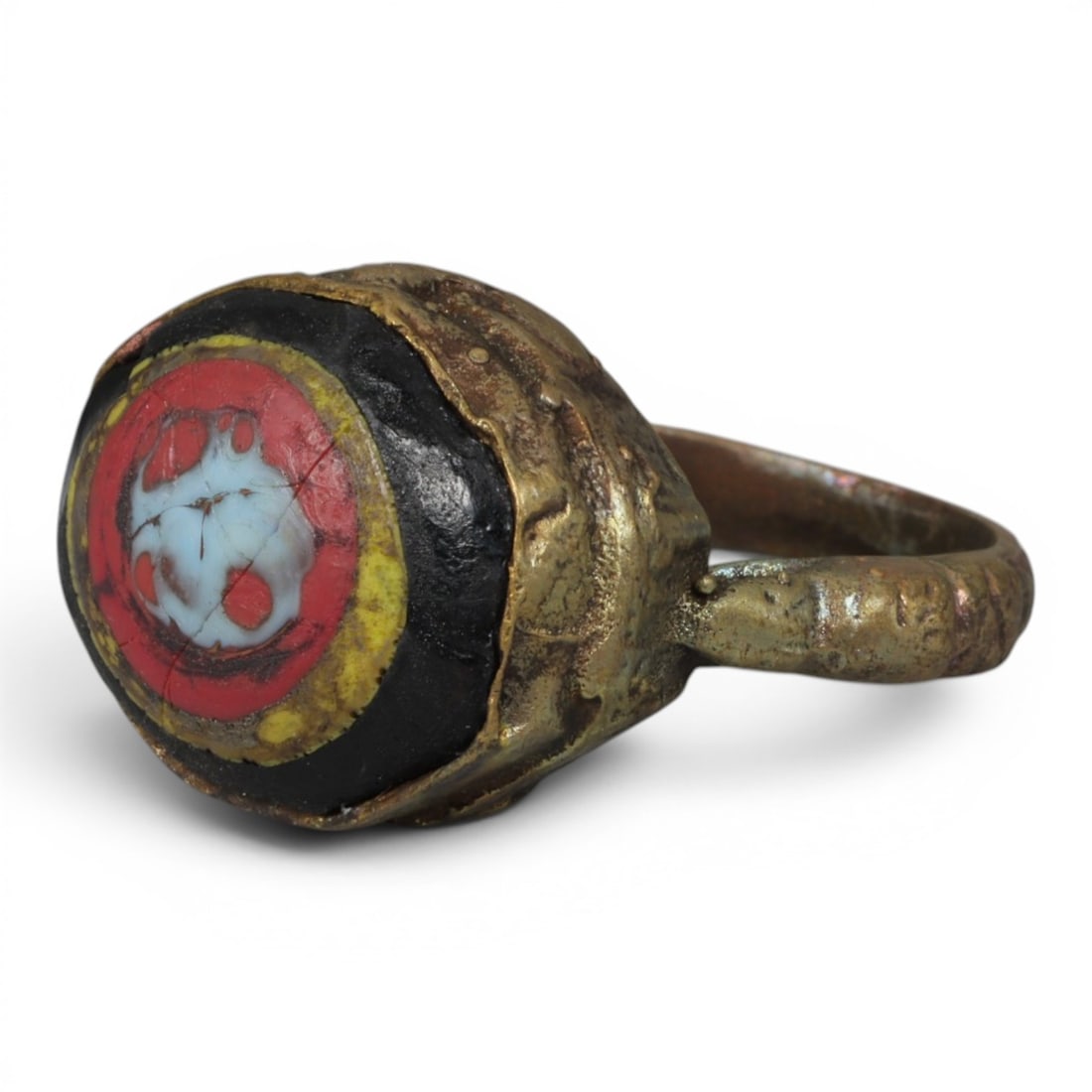 Antique Qajar Dynasty Gilt Evil Eye Ring, US Size 9.5, 11AJ: A gilt-metal ring of the Qajar period, US ring size 9.5, featuring a large, domed evil-eye glass inlay with vibrant concentric red, yellow, black, and white layers. The central motif is a stylized evi