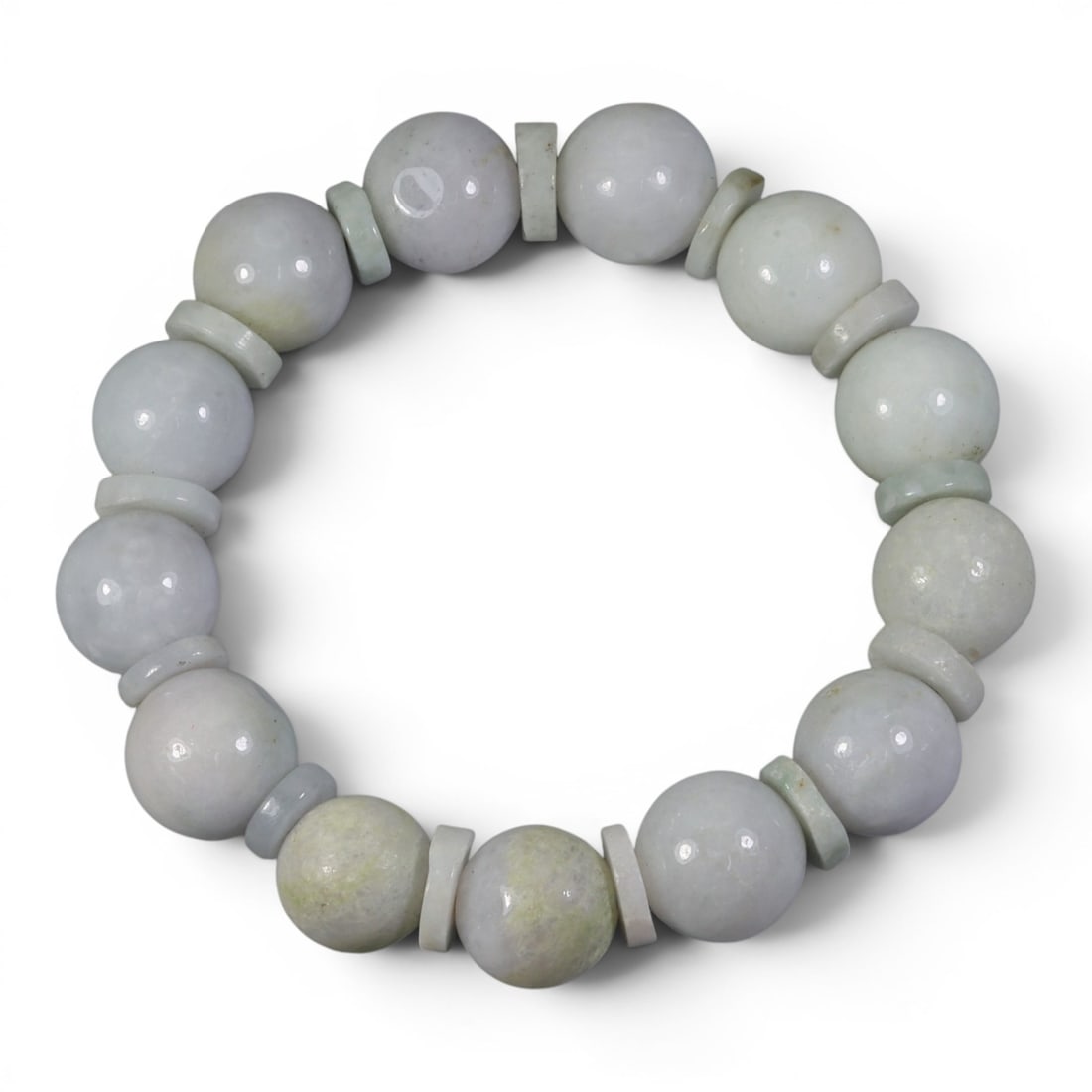Natural Type A Burmese Jadeite Beaded Bracelet, 97AJ: Let me show you this lovely, calming jadeite bracelet, perfect for everyday wear! This bracelet has a 50mm diameter and features a simple yet elegant design of round beads paired with disc spacers. Th
