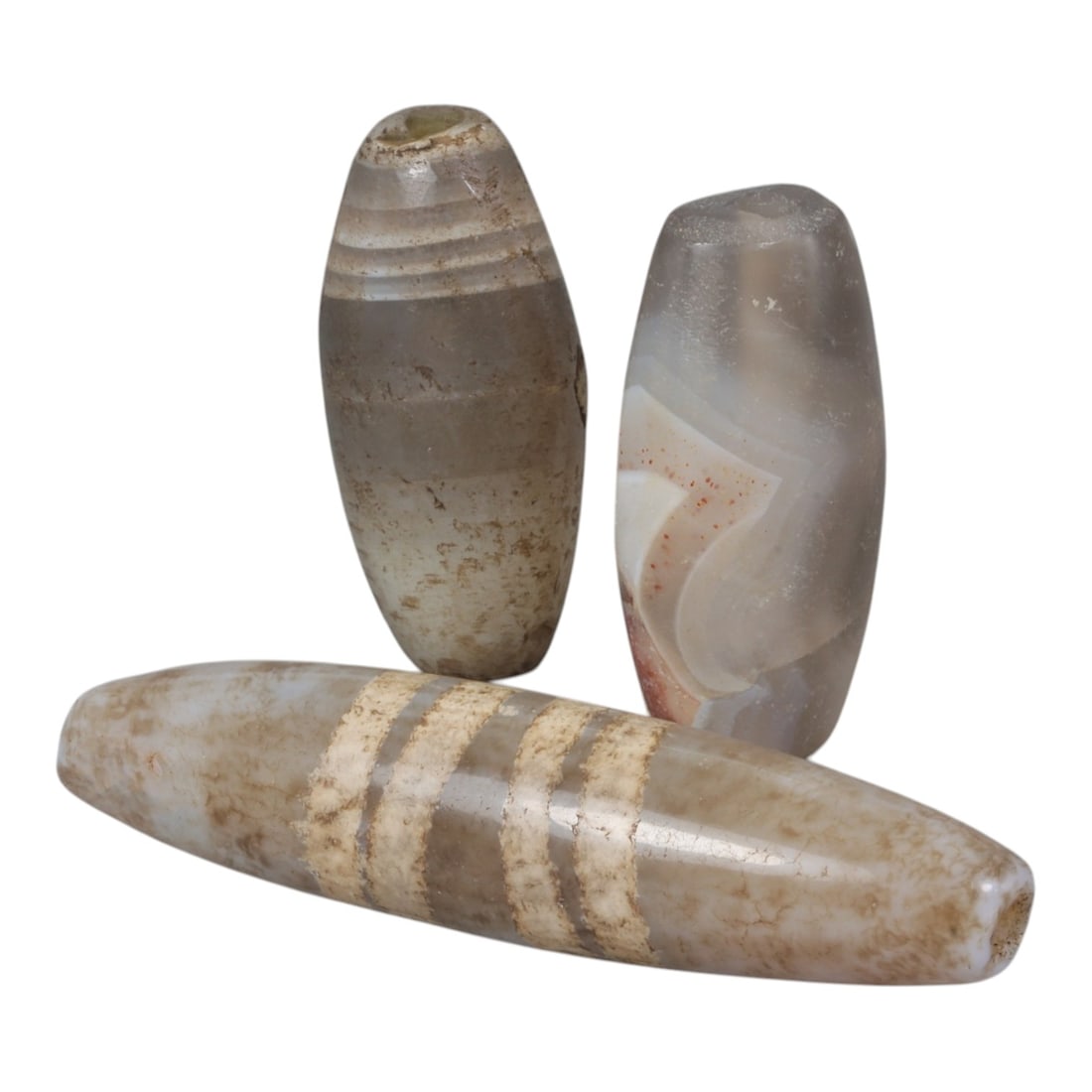 Lot of 3 Antique Central Asian / Himalayan Banded Agate Trade Beads, 15th-19th Century., 76AK: This lot comprises 3 antique banded agate beads, characteristic of Central Asian or Himalayan trade traditions. Each bead exhibits signs of significant age, including natural patination, surface wear,