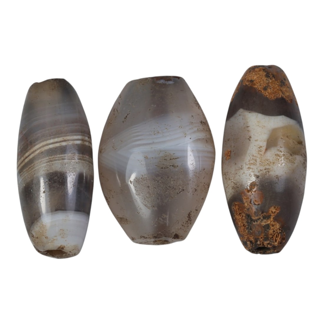 Lot of 3 Antique Central Asian / Himalayan Banded Agate Trade Beads, 15th-19th Century., 58AK: This lot comprises 3 antique banded agate beads, characteristic of Central Asian or Himalayan trade traditions. Each bead exhibits signs of significant age, including natural patination, surface wear,