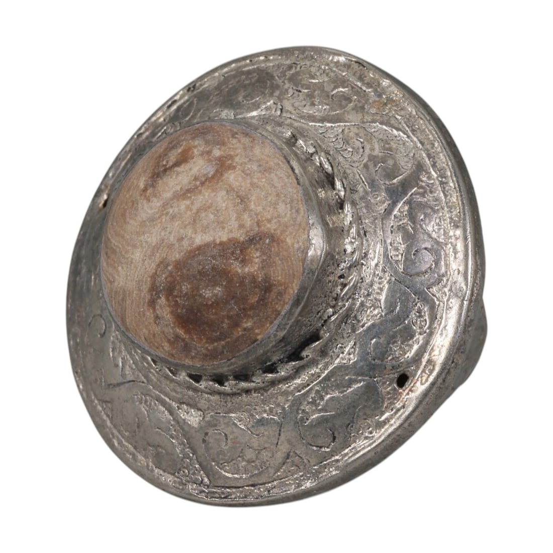 A Middle Eastern Silver Plated Banded Agate Ring, Late 19th-Early 20th Century, 4AK: The ring is centered with a large domed cabochon banded agate stone exhibiting natural layered brown and beige striations, set within a raised bezel accented by twisted wirework. The wide circular bez