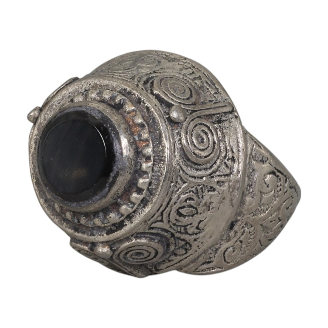 A Middle Eastern Silver Plated Onyx Ring, Late 19th-Early 20th Century, 9AK: The ring is centered with a round cabochon onyx stone set within a domed bezel featuring a raised beaded border. The bezel and shoulders are engraved with stylized spiral and foliate motifs. The silve