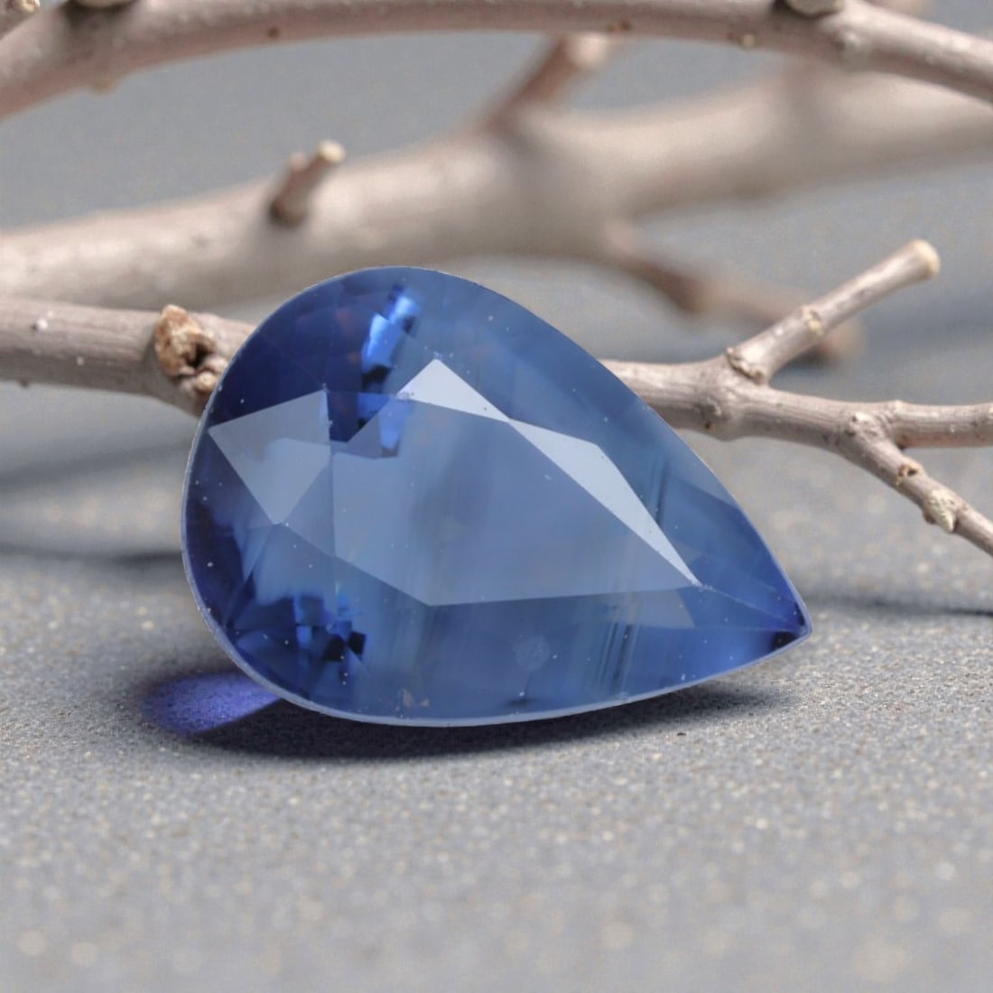 0.98 Carats Natural Cornflower Blue Madagascar Sapphire Pear Cut, 82AK: This pear-shaped Madagascar blue sapphire displays a soft, luminous cornflower blue hue, with subtle natural banding that adds organic depth and dimensionality to its appearance. The faceted cut featu