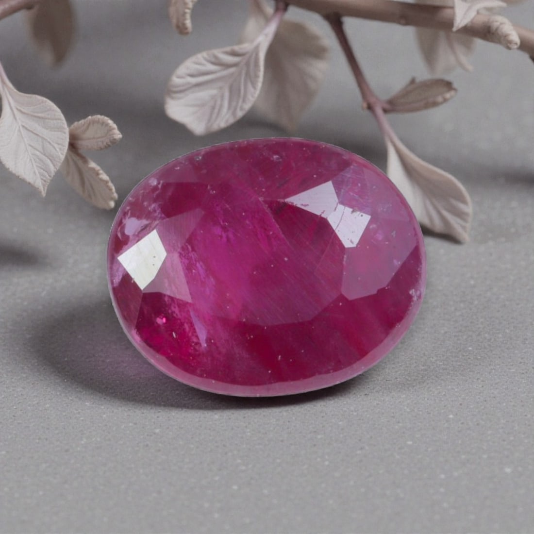 1.04 Carats Natural Pinkish Red Mozambique Ruby Oval Cut, 94AK: This oval-cut natural ruby displays a rich pinkish-red hue, with subtle natural banding and tonal variations that add organic depth and warmth to its appearance. The faceted cut features well-proporti