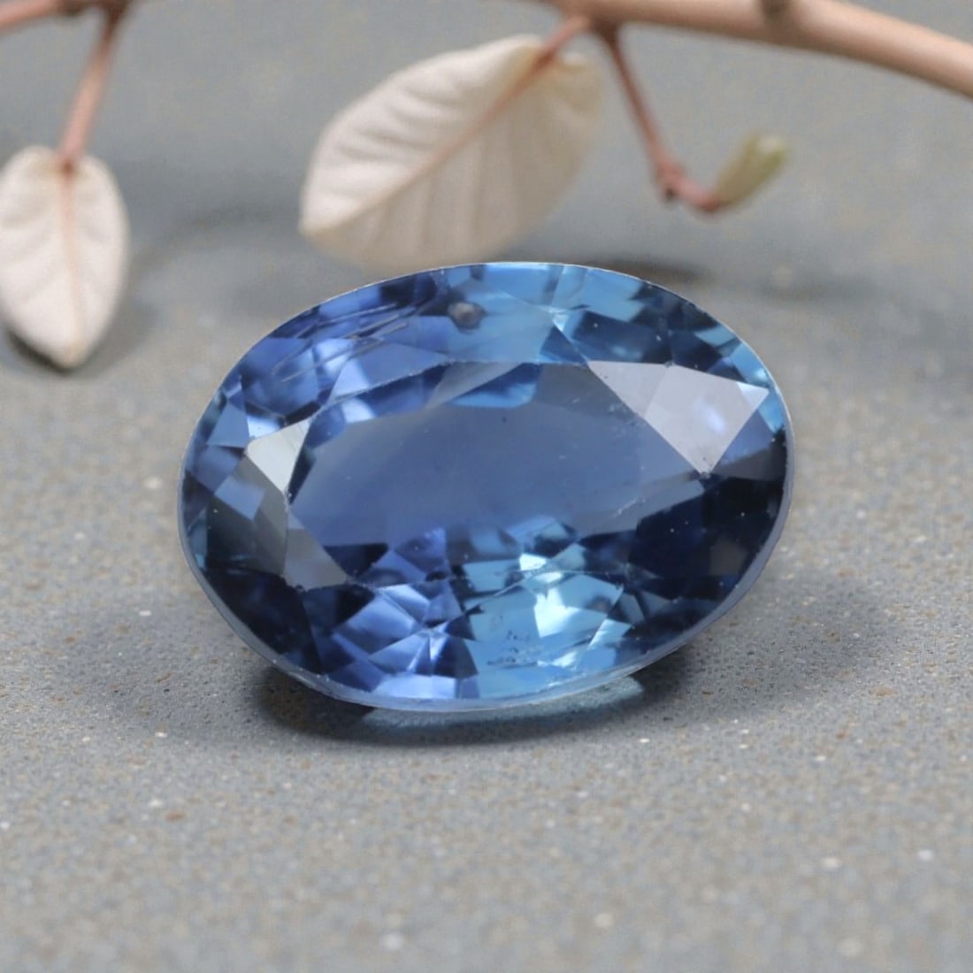0.67 Carats Natural Cornflower Blue Madagascar Sapphire Oval Cut, 89AK: This oval-cut Madagascar blue sapphire displays a soft, luminous cornflower blue hue, with gentle tonal variations that lend natural depth and dimensionality to its appearance. The faceted cut is poli