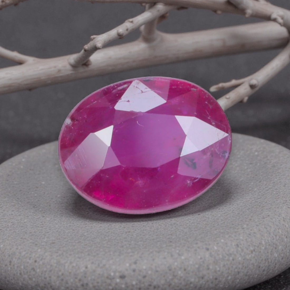 0.82 Carats Natural Pinkish Red Mozambique Ruby Oval Cut, 16AL: This oval-cut natural ruby showcases a soft pinkish-red hue with subtle purple undertones, featuring natural inclusions and faint internal characteristics that add organic depth and authenticity to it