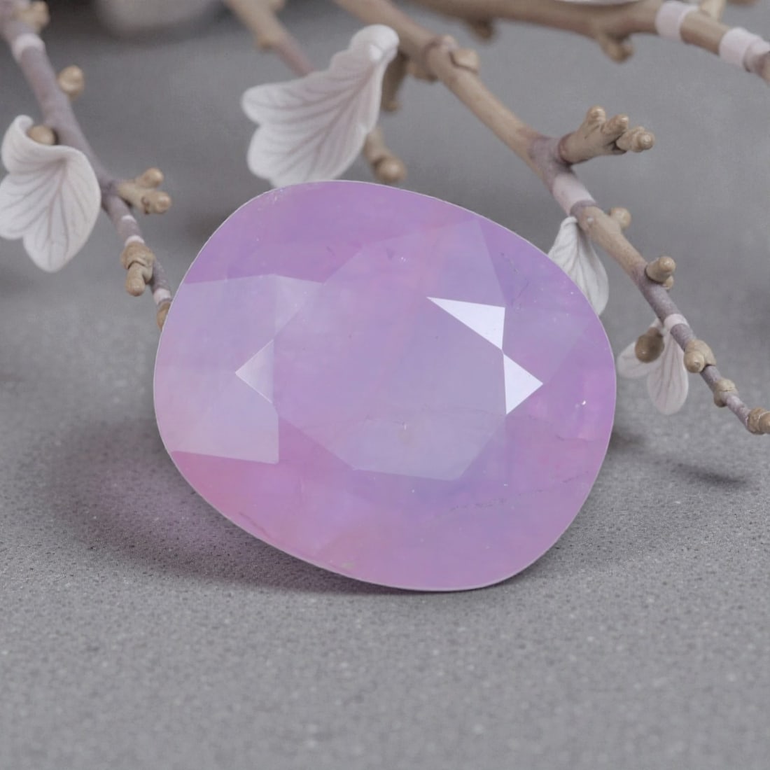 3.62 Carats Natural Sri Lankan Pink Sapphire Cushion Cut, 38AL: This cushion-cut natural pink sapphire showcases a dreamy, ethereal lavender-pink hue, reminiscent of blooming cherry blossoms at dawn. The faceted cut features soft, rounded edges and well-proportion