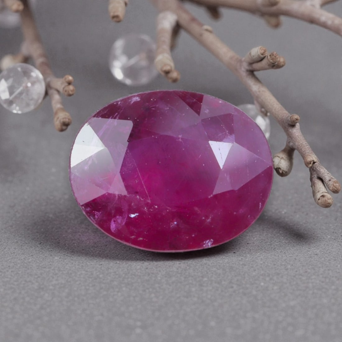 1.62 Carats Natural Pinkish Red Mozambique Ruby Oval Cut, 14AL: This oval-cut natural ruby showcases a rich pinkish-red hue with subtle tonal variations, featuring natural inclusions and faint internal characteristics that add organic depth and authenticity to its