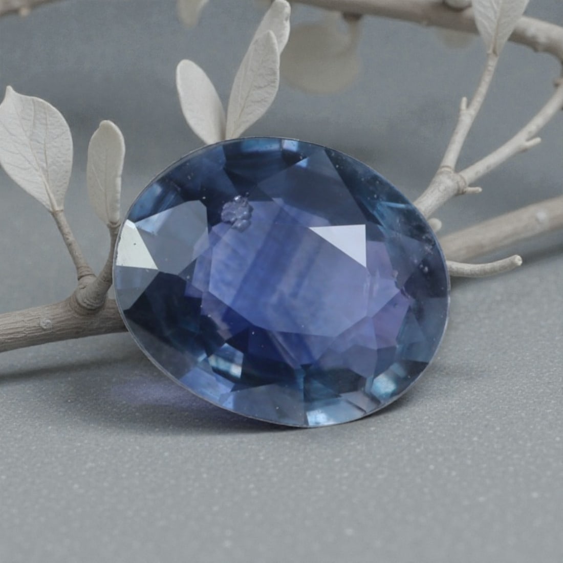 0.70 Carats Natural Madagascar Blue Sapphire Oval Cut, 23AL: This oval-cut natural blue sapphire showcases a rich, multi-tonal blue hue with subtle teal and violet undertones, evoking the serene depth of the Indian Ocean. The faceted cut features well-proportio