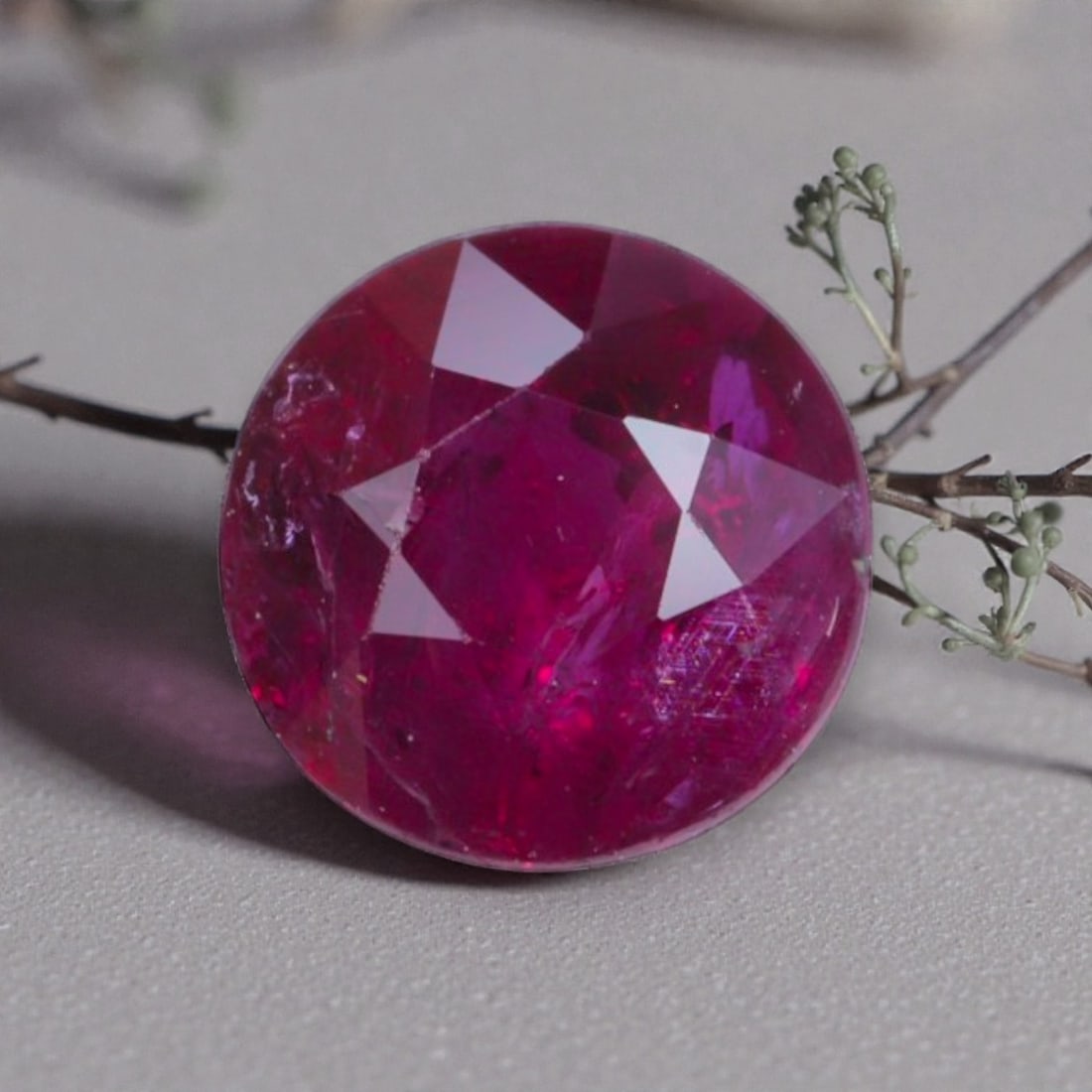 1.03 Carats Natural Vivid Red Mozambique Ruby Round Cut, 20AL: This round-cut natural ruby showcases a rich, saturated vivid red hue, with subtle natural inclusions and internal characteristics that add organic depth and authenticity to its appearance. The facete