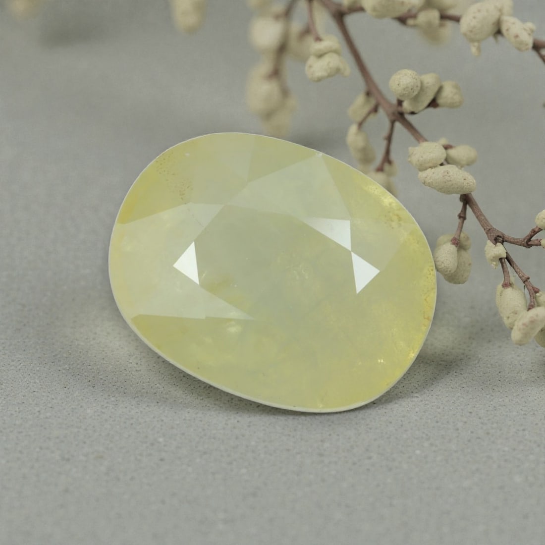 5.31 Carats Natural Sri Lankan Yellow Sapphire Oval Cut, 37AL: This oval-cut natural yellow sapphire showcases a soft, buttery yellow hue, evoking the warm glow of tropical sunlight. The faceted cut features well-proportioned facets that create gentle light play,
