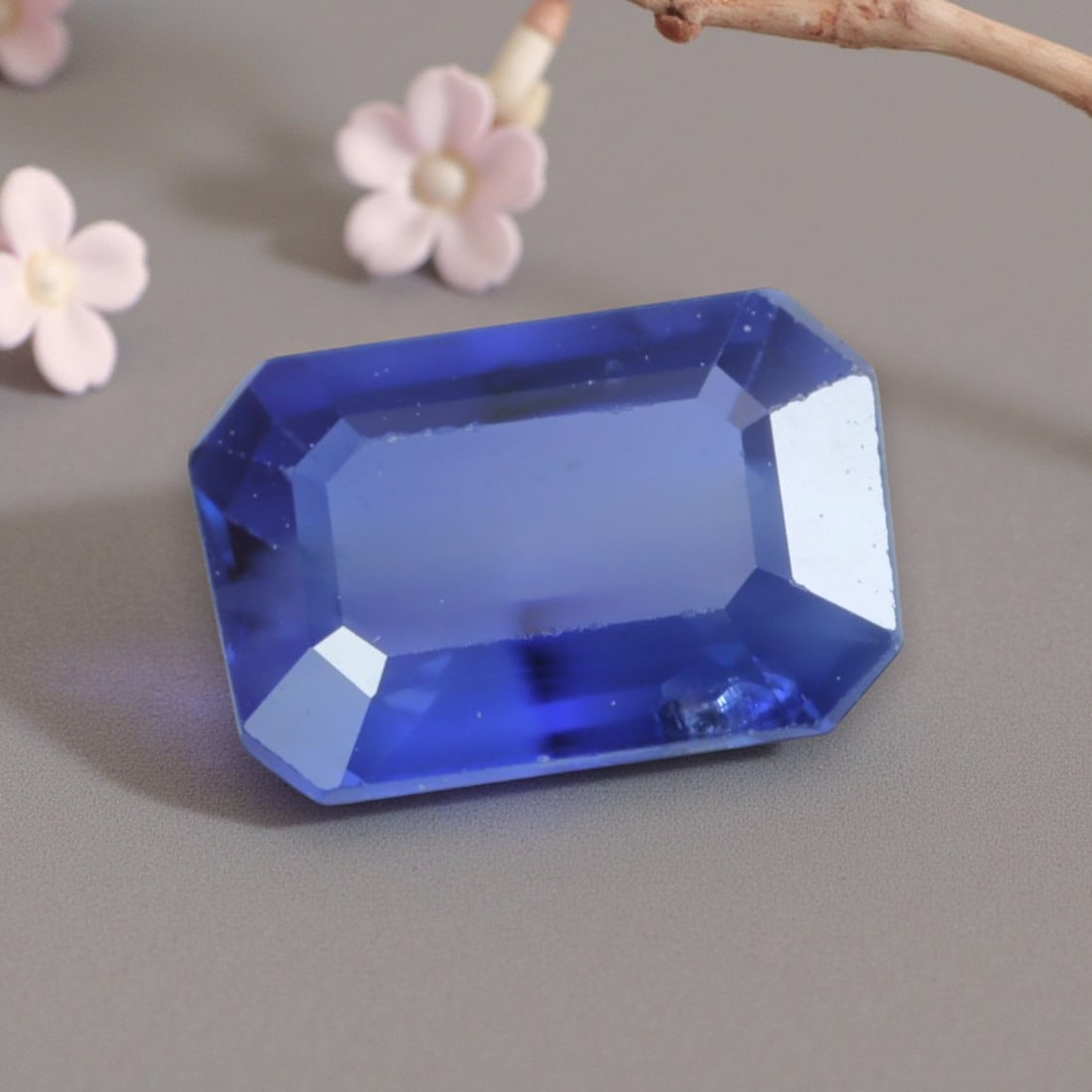 0.76 Carats Natural Cornflower Blue Madagascar Sapphire Emerald Cut, 91AK: This elegant Madagascar blue sapphire displays a soft, luminous cornflower blue hue, evoking the delicate tones of summer skies with a subtle, even saturation that glows under light. The classic emera