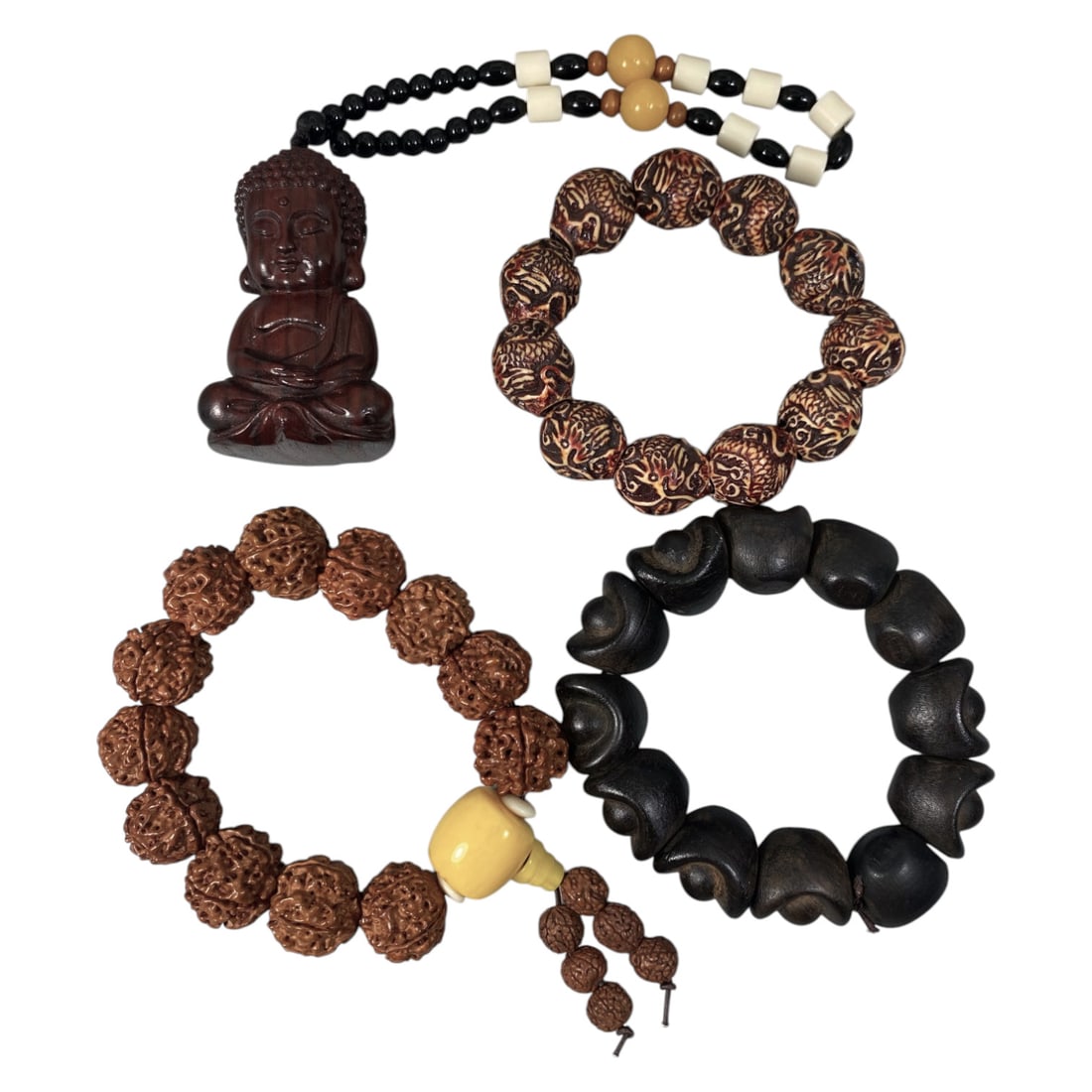 Lot of 4 Vintage Oriental Chinese Wood and Seed Bead Bracelets, 65AG: The group consists of four vintage bracelets and one pendant strand crafted from wood and seeds. The top-left strand features a carved dark wood seated Buddha pendant suspended from alternating black,
