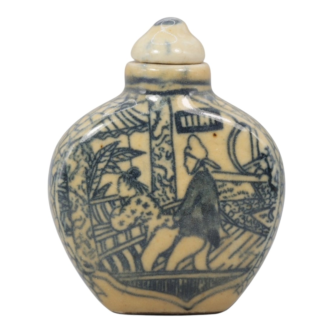 A Chinese Porcelain Snuff Bottle, 20th Century, 2YD: Made of porcelain with a pale yellowish glaze and underglaze blue decoration, the snuff bottle has a flattened, rounded body, a short cylindrical neck, and a matching domed stopper. The main surface i