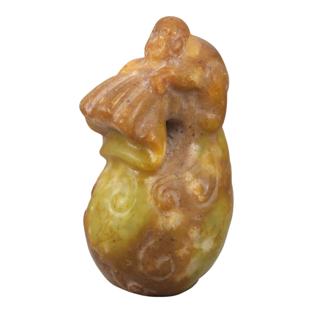 A Chinese Jade Monkey and Peach Carving, 20th Century, 80YA: Carved from translucent jade with warm honey-brown and yellow tonal variation, the sculpture is worked fully in the round as a vertical composition. The form depicts a monkey perched atop a large peac