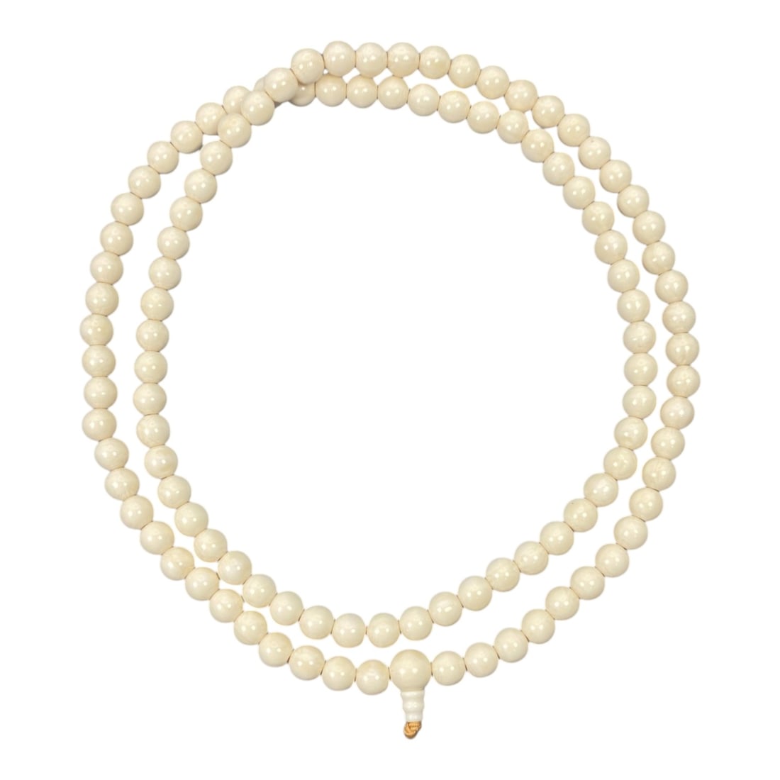 Horn Beaded Necklace - Buddhist Prayer Mala, 20th Century, 50FV: Crafted from horn, this beaded necklace consists of uniformly sized, spherical beads strung in a continuous loop, terminating in a traditional guru bead and tassel. The form and structure are characte