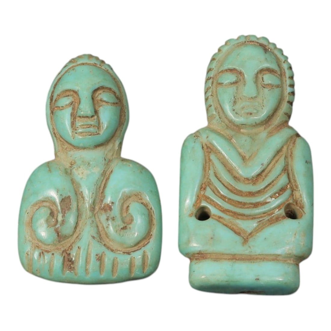 Lot of 2 Ancient Coptic Egyptian Turquoise Stone Figural Amulets, Circa Roman to Coptic Era, 87AD: Comprising two finely carved turquoise stone amulets ranging from 2.5 cm to 3 cm, these stylized human figures are characteristic of Coptic Egyptian devotional jewelry. Both pieces feature serene, sim