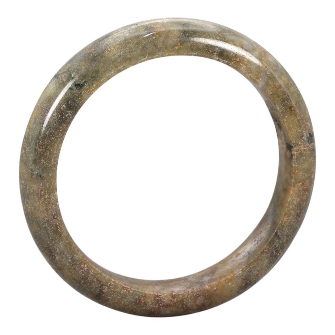 A Chinese Jadeite Jade Bangle Bracelet, 20th Century, 77ZK: Carved from jadeite jade with a muted olive-green base and scattered brownish-red inclusions, the bangle is formed as a continuous circular band with a rounded cross-section. The surface is smoothly p