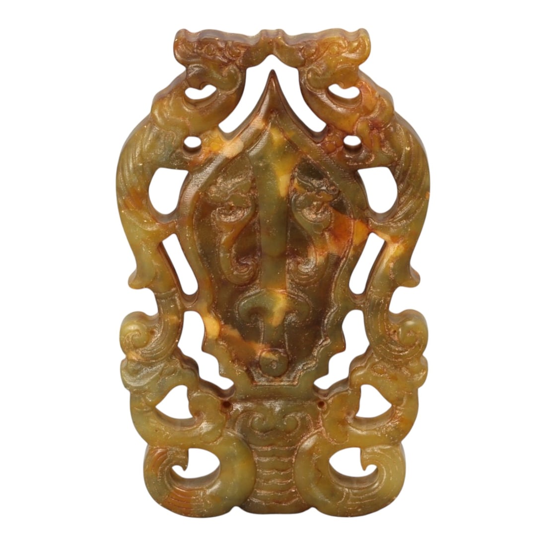A Chinese Hardstone Openwork Plaque with Archaistic Mask Motif, 20th Century, 8YB: Carved from a mottled hardstone of translucent green, amber, and russet tones, the plaque is worked in openwork and low relief as a vertically oriented composition. The central field is dominated by a