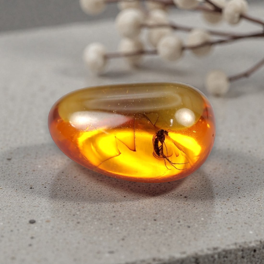 2.38 Carats Teardrop Amber Cabochon with Insect Inclusion - Natural Baltic Stone, LZ86: This captivating 2.38 carat amber cabochon, measuring 13.2mm x 9.4mm x 6.2mm, is a breathtaking prehistoric treasure. Polished into a smooth, organic teardrop shape, the stone glows with a rich, lumin