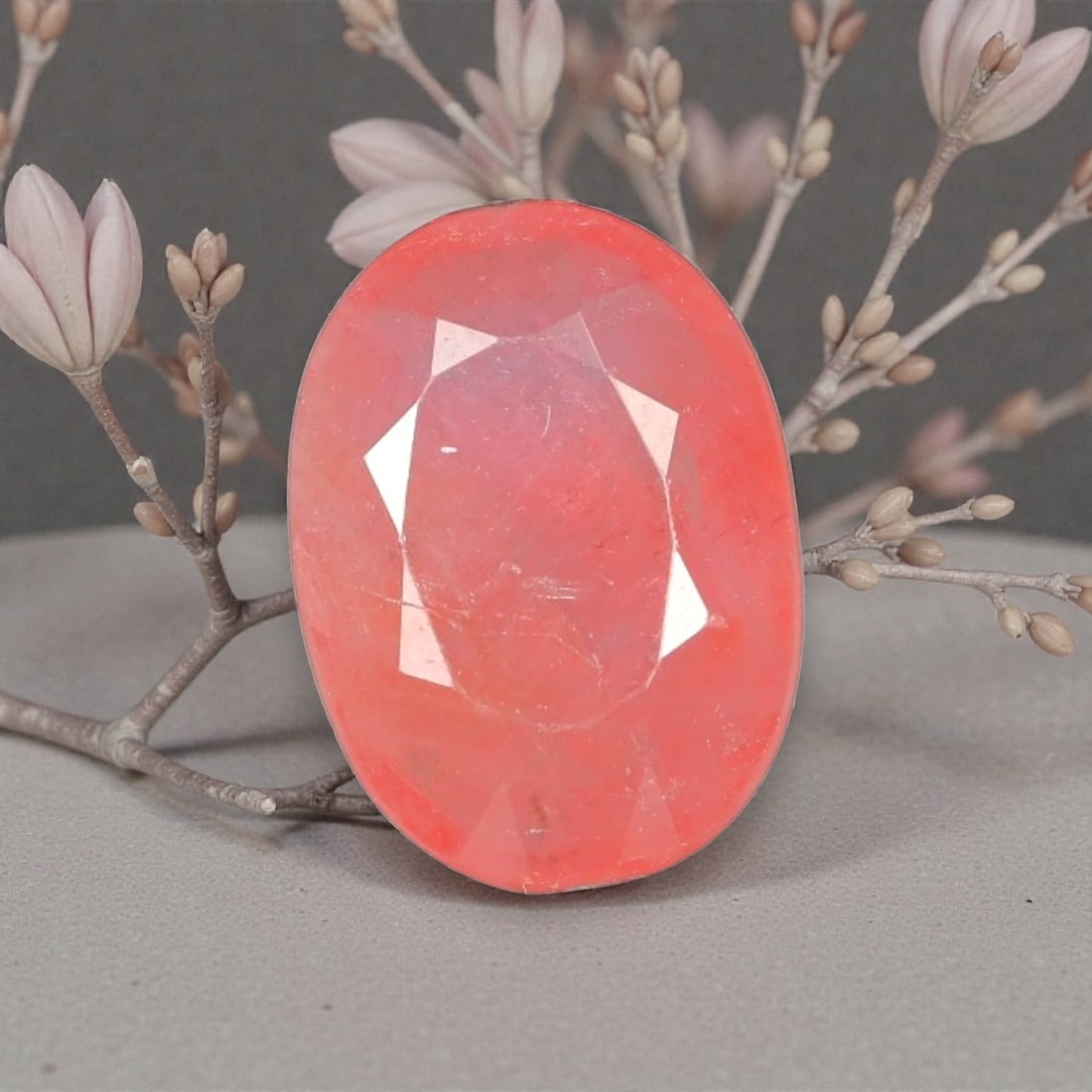 2.82 Carats Certified Orange Pink Sapphire - Natural Ceylon Gemstone, LZ113: This enchanting 2.82 carat oval faceted sapphire captivates with a delicate orange-pink hue, a rare and sought-after shade that evokes the soft glow of a tropical sunrise. The precision oval cut enhan