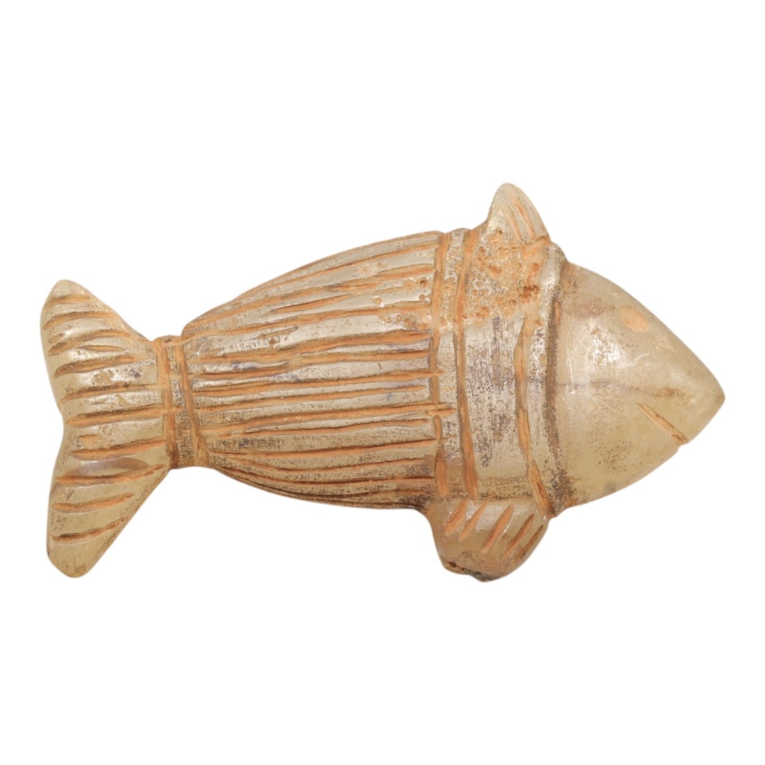Ancient Chalcedony Fish - Zoomorphic Amulet Figurine, 64ZP: This zoomorphic amulet is carved from translucent chalcedony, shaped into a stylized fish form with incised linear details defining the segmented body, fins, and tail, alongside a small incised eye an