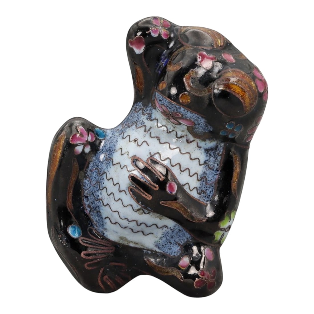 A Chinese Enamel Frog Effigy, 20th Century, 10FH: Modeled as a stylized frog shown seated upright with the head tilted upward and forelimbs drawn toward the chest, the effigy is formed from a metal core and decorated with painted enamel rather than c