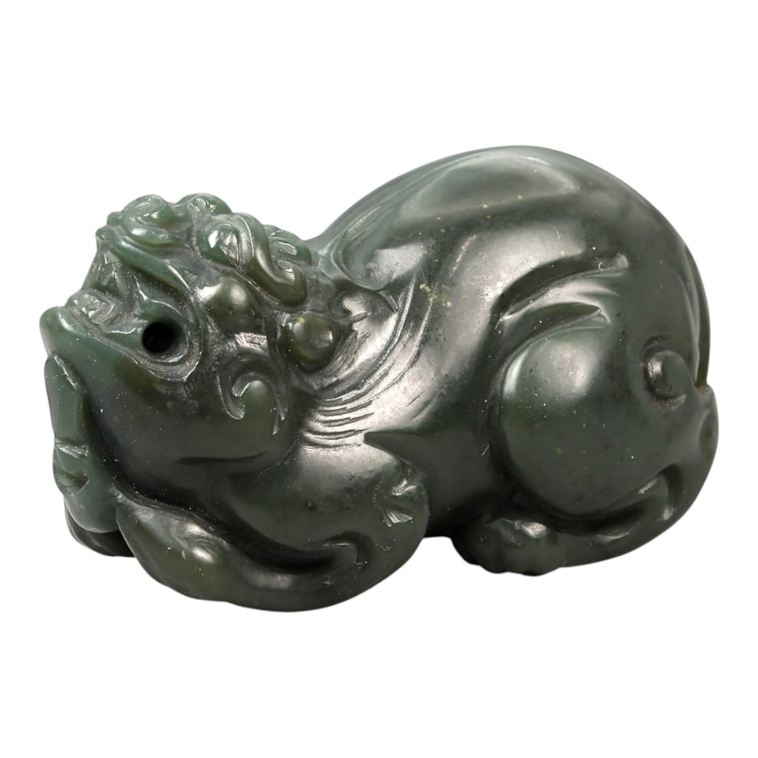 Chinese Jade Pixiu Beast - Carved Animal Figurine 4.6cm, 92ZC: Carved from deep green jade with soft translucency and scattered darker inclusions, this small sculptural figure depicts a pixiu rendered in a compact recumbent posture. The carving is worked fully in