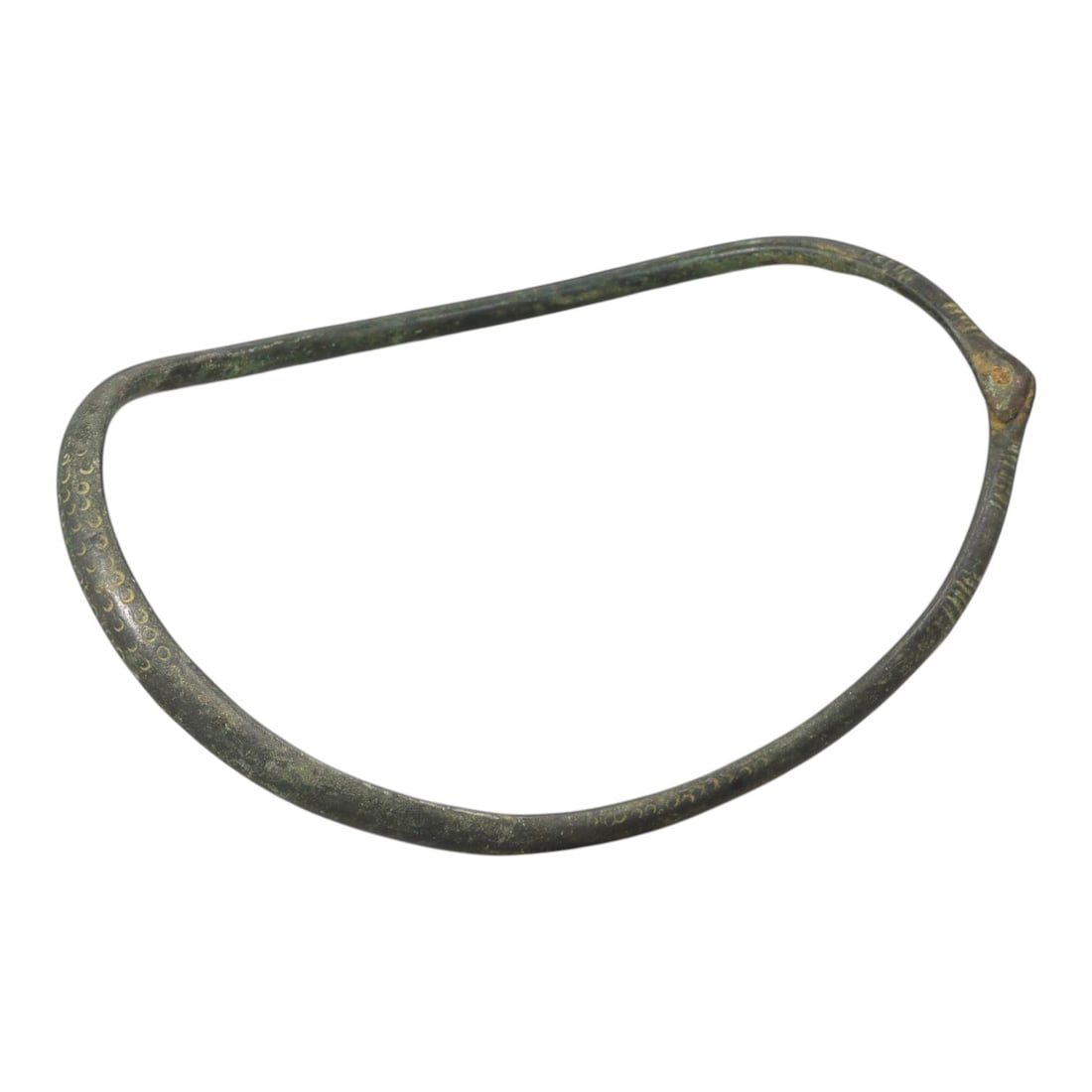 Ancient Bronze Anklet - Roman Decorated Penannular Bangle, 30BN: A penannular bronze anklet of ancient Roman origin, formed from a slender, rounded bronze band. The outer surface features continuous incised dot motifs, providing subtle decorative detail characteris