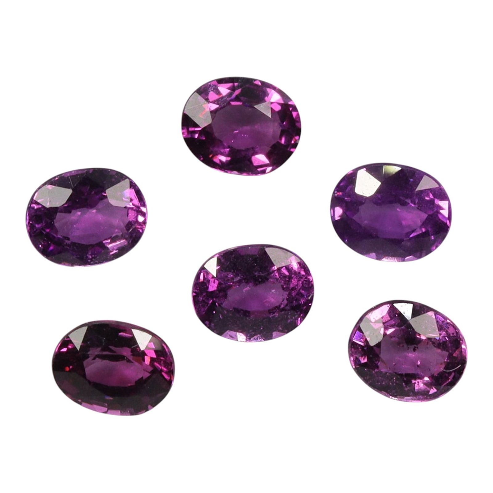 3.08 Carats Raspberry Rhodolite Garnet Oval Parcel - Natural Loose Stones, 68XM: This vibrant parcel of rhodolite garnets dazzles with a rich, saturated raspberry-pink hue, ranging from deep magenta to bright rose tones that glow with natural warmth. The total carat weight of the 