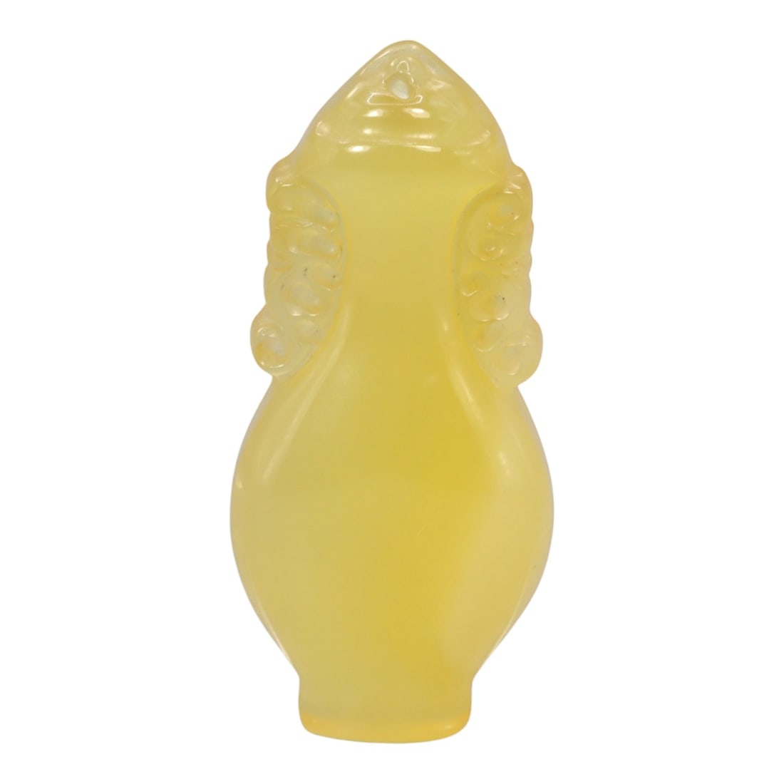 A Chinese Chalcedony Locket Amulet, 20th Century, 94FH: Carved from translucent yellow chalcedony with an even, softly diffused tone, the amulet is formed as a small locket-shaped vessel with a tapering neck and rounded body. The surface is smoothly polish