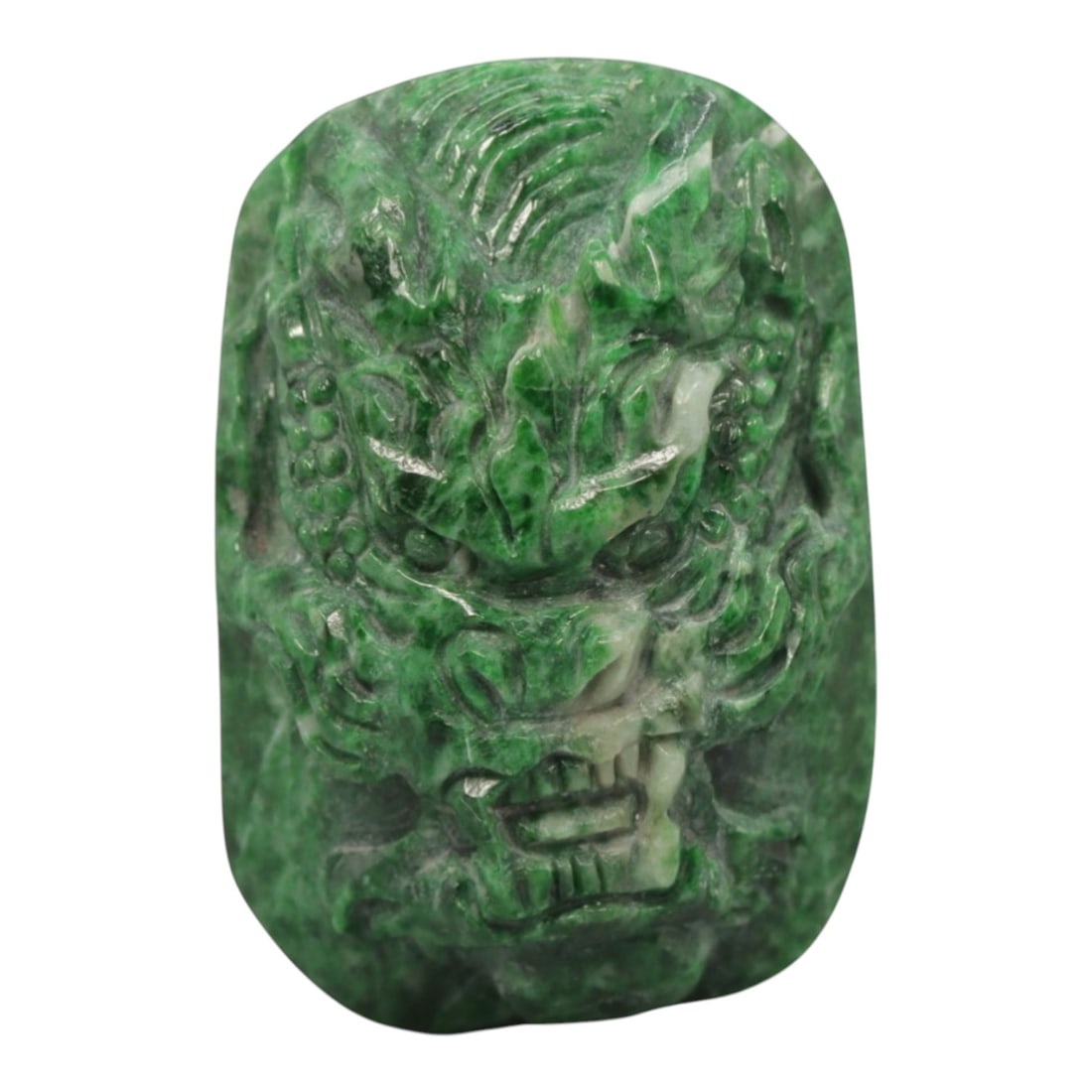 A Maw Sit Sit Dragon Pendant, 20th Century, 17ZL: Carved from green maw sit sit with natural white inclusions distributed throughout the matrix, the pendant is formed as a rectangular object with a relief-carved dragon head motif on the exterior surf