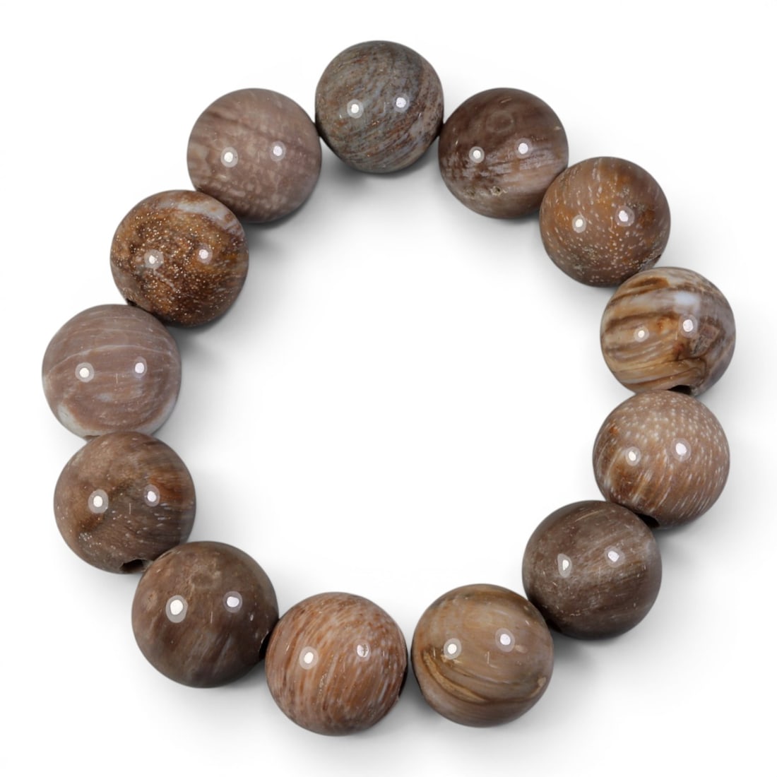 Natural Burmese Fossilized Wood Beaded Bracelet, 99AJ: Here's a closer look at this stunning, earthy fossilized wood bracelet-ancient history you can wear on your wrist! This 56mm bracelet is strung with smooth, polished round beads of natural Burmese fos