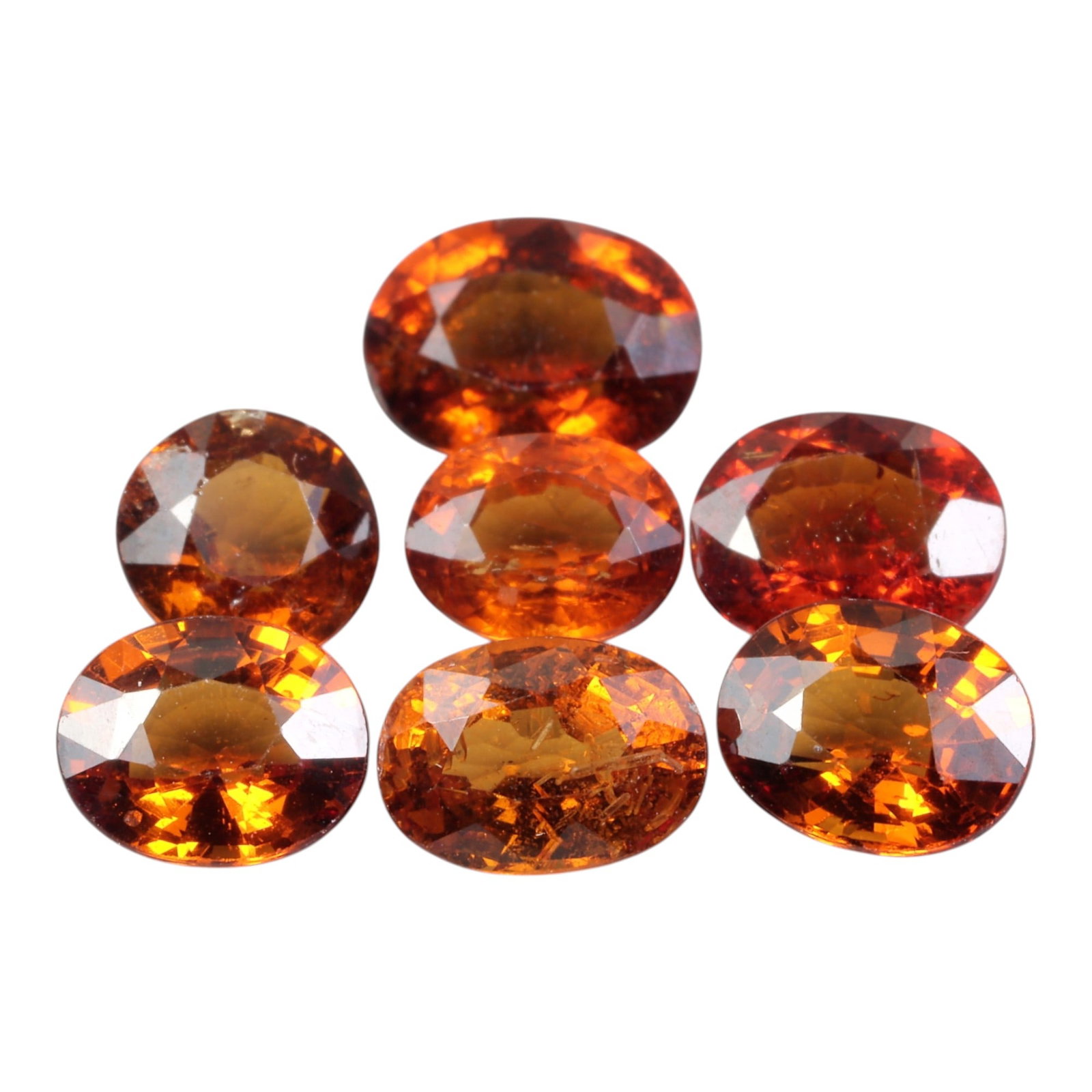 8.67 Carats Spessartite Garnet Oval Parcel - Natural Loose Stones, 74XC: This striking parcel of garnets dazzles with an intense, saturated orange hue, reminiscent of glowing embers and ripe citrus fruit. The total carat weight of the lot is 8.67 carats, with each oval-cut