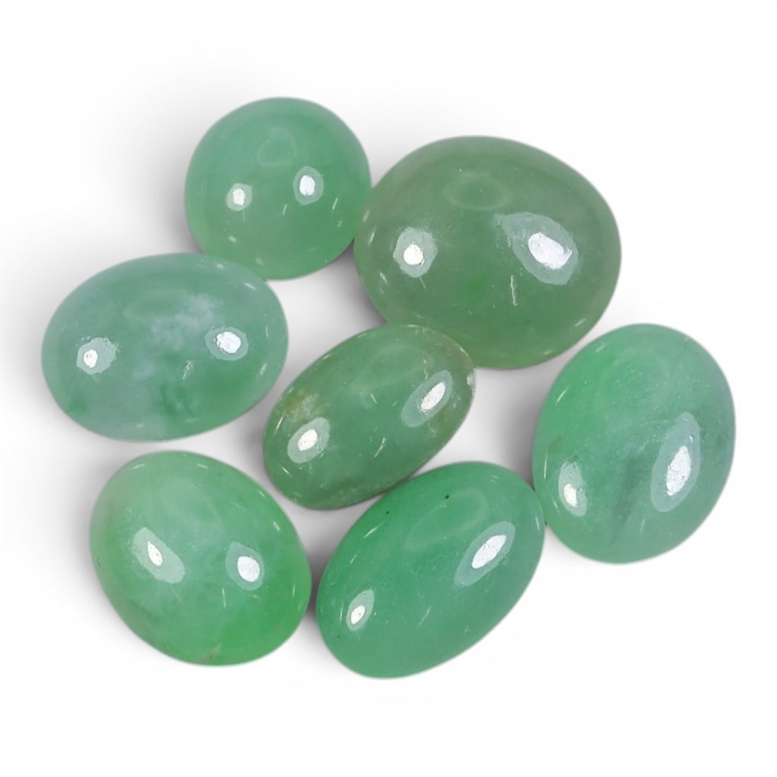 17.62 Carats Natural Type A Burmese Jadeite Cabochon Lot, 96AJ: Let me share with you this sweet little lot of seven natural jadeite cabochons, each one glowing with its own soft, fresh green hue! Look at the lovely range of springtime greens here-from pale mint t