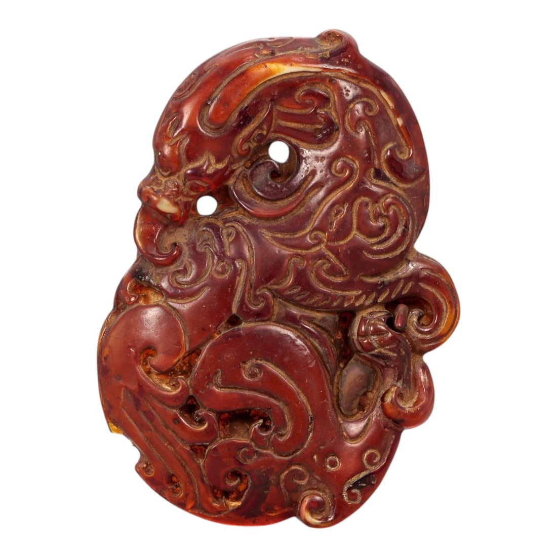A Chinese Amber-Resin Openwork Plaque with Mask Motif, 20th Century, 90FC (1 of 2)
