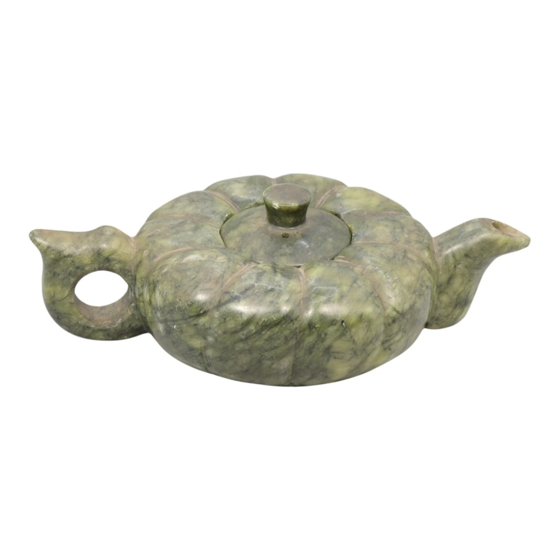 A Chinese Hetian Jade Teapot, 20th Century, 50YC: Carved from mottled green Hetian jade with cloudy translucency and darker mineral inclusions, the teapot is formed with a low, compressed lobed body divided into rounded segments radiating from the ce