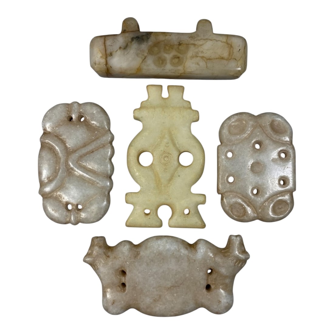 Lot of 5 Ancient Near Eastern Marble Amulets and Plaques, 2AJ: Carved from polished marble with natural veining and subtle patination, the group consists of five distinct amulets and plaques, ranging in size from 4.5 cm to 6.5 cm (1.77-2.56 in.). The set features