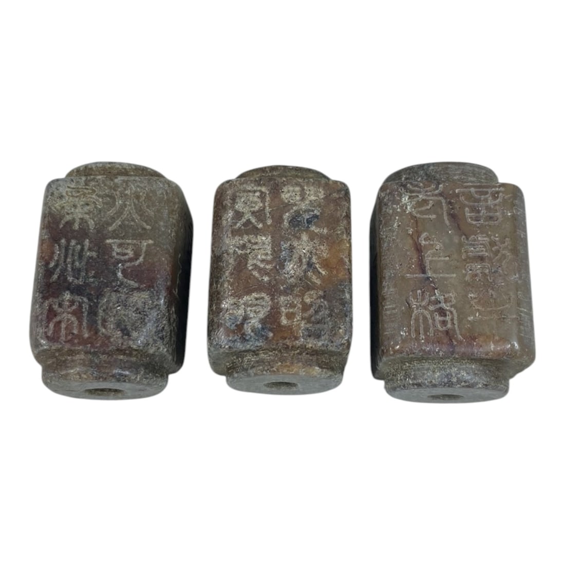A Lot of 3 Antique Chinese Agate Beads with Inscriptions, 59AB: The group comprises three antique Chinese agate beads of a square-tubular form, exhibiting warm brown and reddish tones with natural inclusions and age-related patina. Each bead is fully perforated an