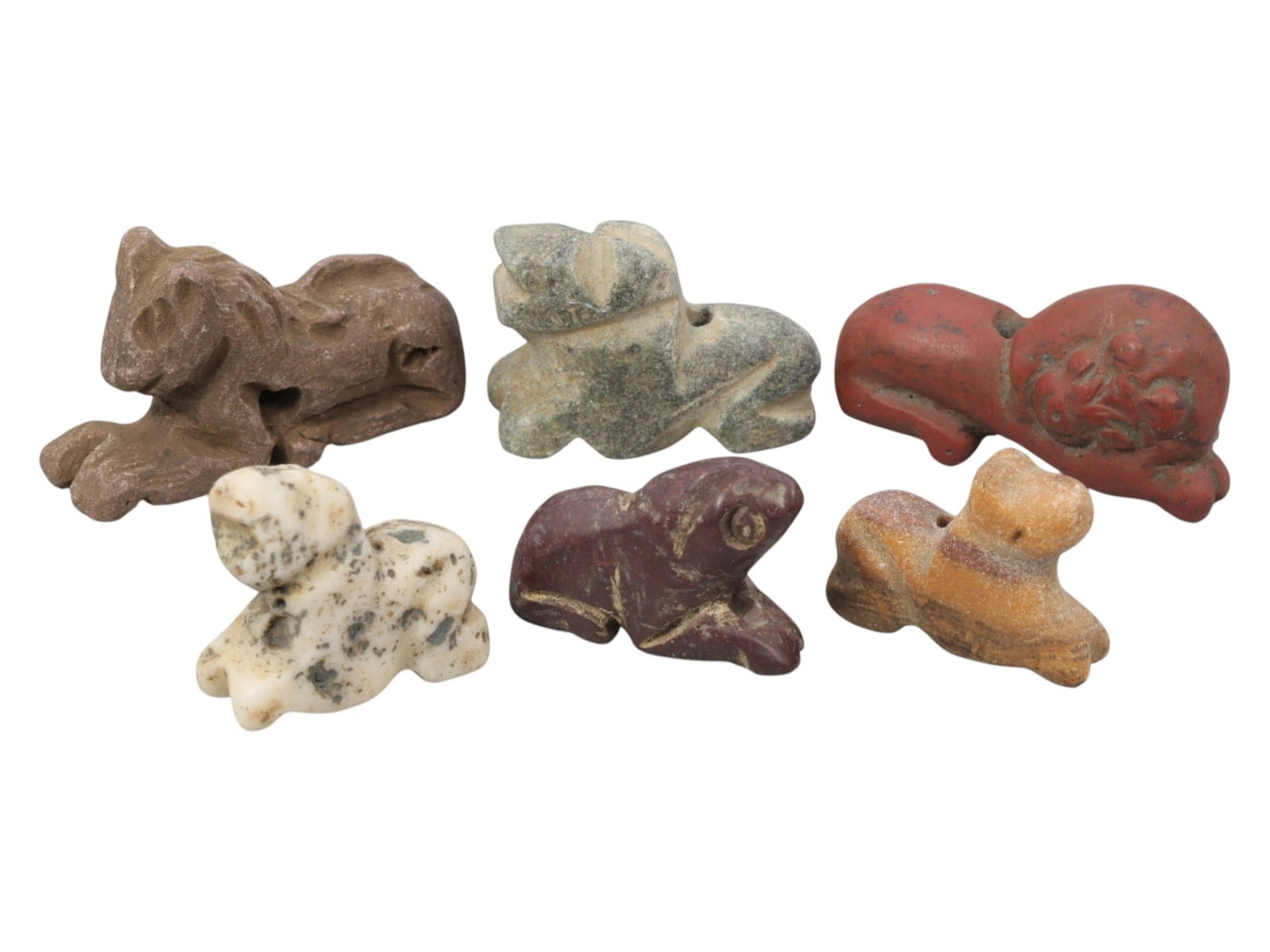 Lot of 6 Ancient Near Eastern Zoomorphic Stone Amulets, c. Iron Age to Sasanian Period, 88WK: A curated collection of six zoomorphic stone amulets from the Ancient Near East, carved from varied materials including brown, grey, red, speckled white, maroon, and banded stone. The set features sty