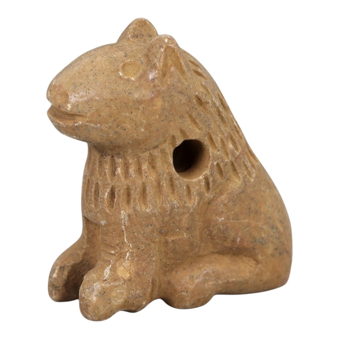 Ancient Stone Feline Amulet - Near Eastern Lion / Cat Figure, 39AM: This amulet is carved from warm beige stone with natural speckling and a smooth, weathered patina, depicting a stylized feline (lion or big cat) in a seated, alert posture. The piece features incised 
