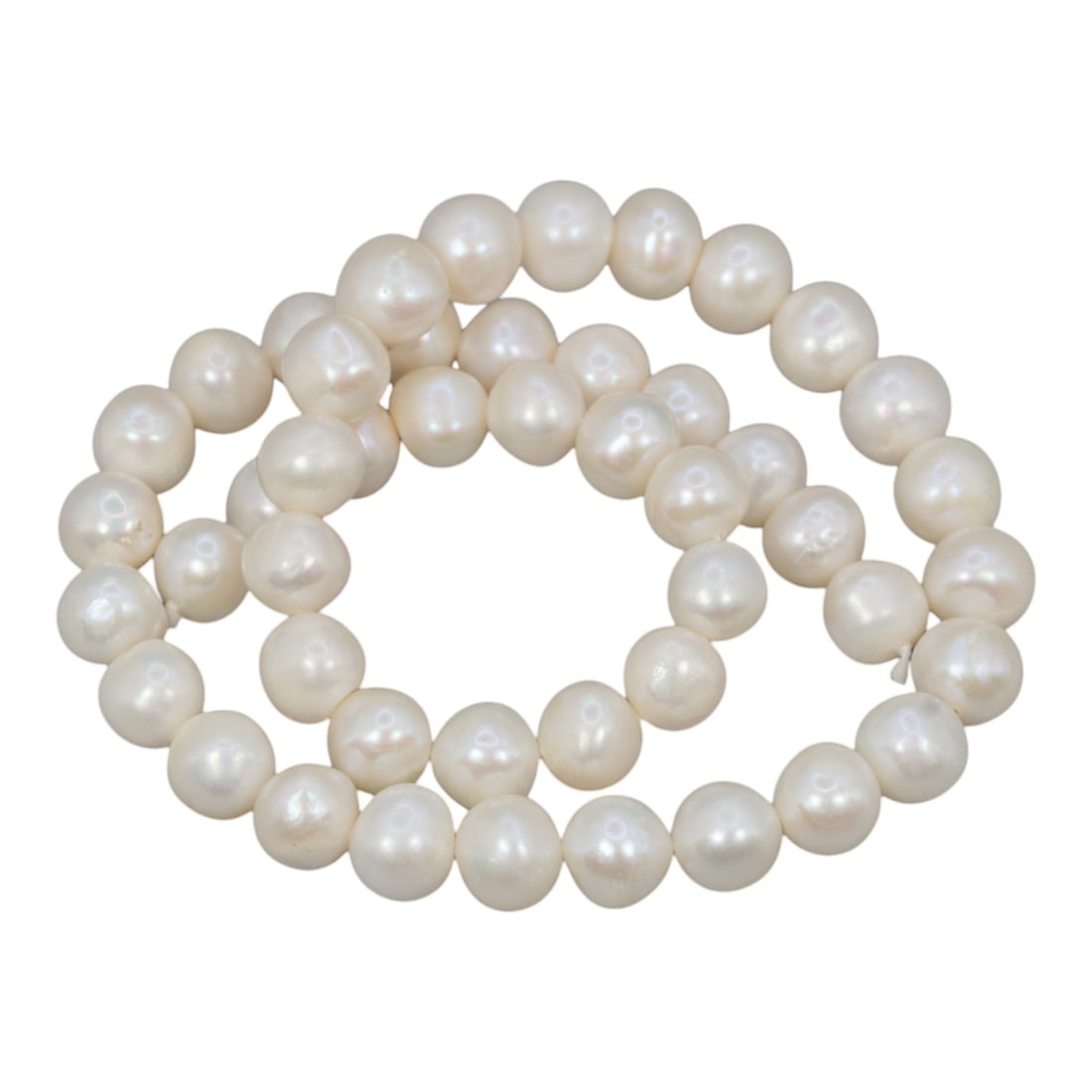 A Strand of Cultured Pearls, 20th Century, 78ZJ: Composed of uniformly sized, near-round cultured pearls with a creamy white body color and subtle pinkish overtones, the strand is strung in a single continuous line. Each pearl exhibits a soft, lustr