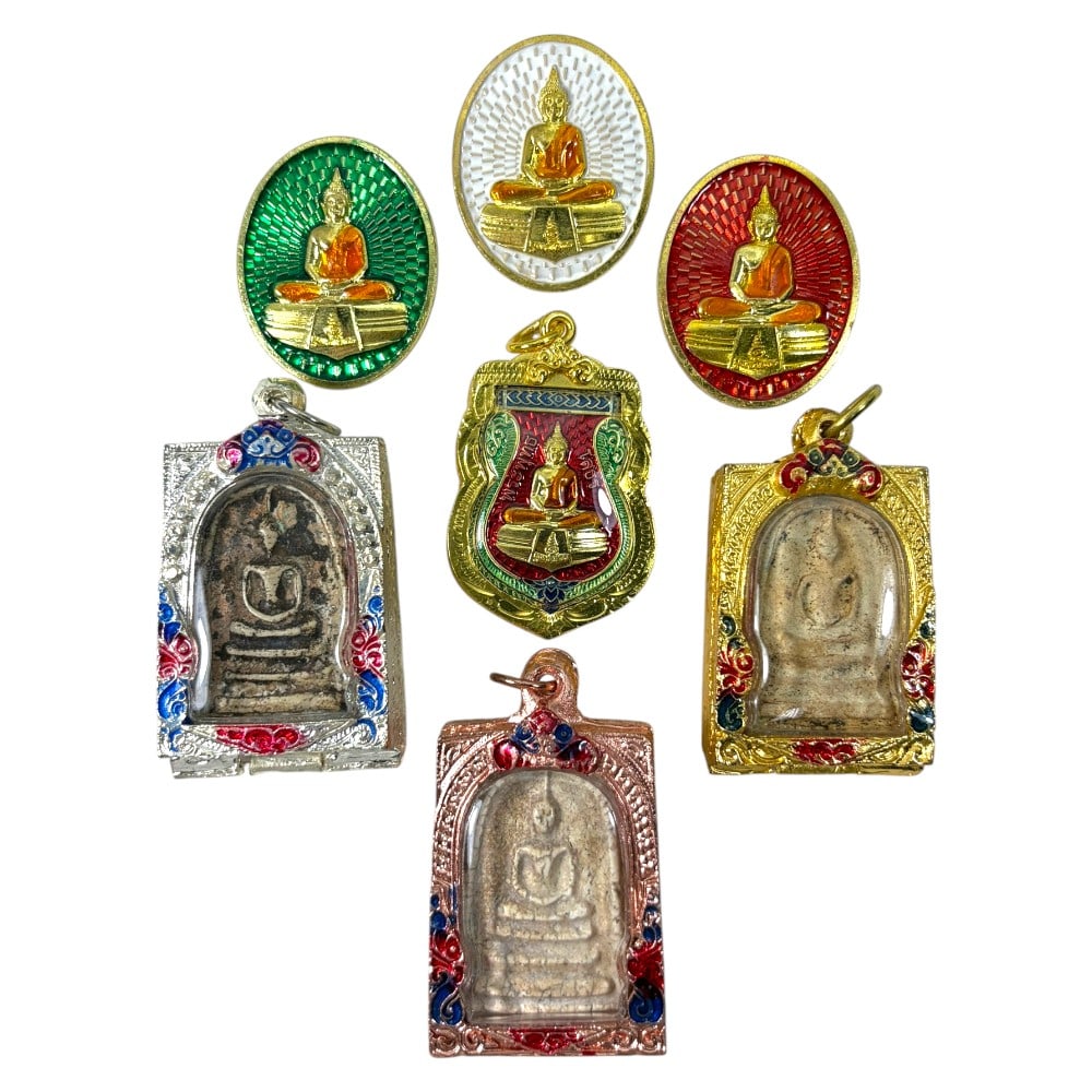 A Lot of 7 Vintage Gilt Thai Buddhist Amulets with Enamel Accents, 24AA: Comprising seven pendants of varying shapes and sizes, ranging from 4 to 5.5 cm in height. The group includes three oval enamel medallions depicting seated Buddha figures, and four rectangular amulets