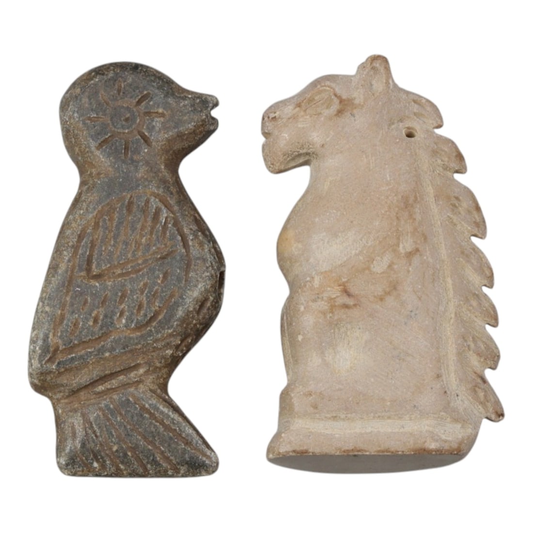 Lot of 2 Ancient Silk Road Stone Effigy Amulets (Bird & Horse), Circa 1st Millennium CE, 3AE: This lot features two finely carved stone effigy amulets from the ancient Silk Road, each standing at approximately 4.5 cm tall. Crafted from distinct stone materials, they showcase the cross-cultural