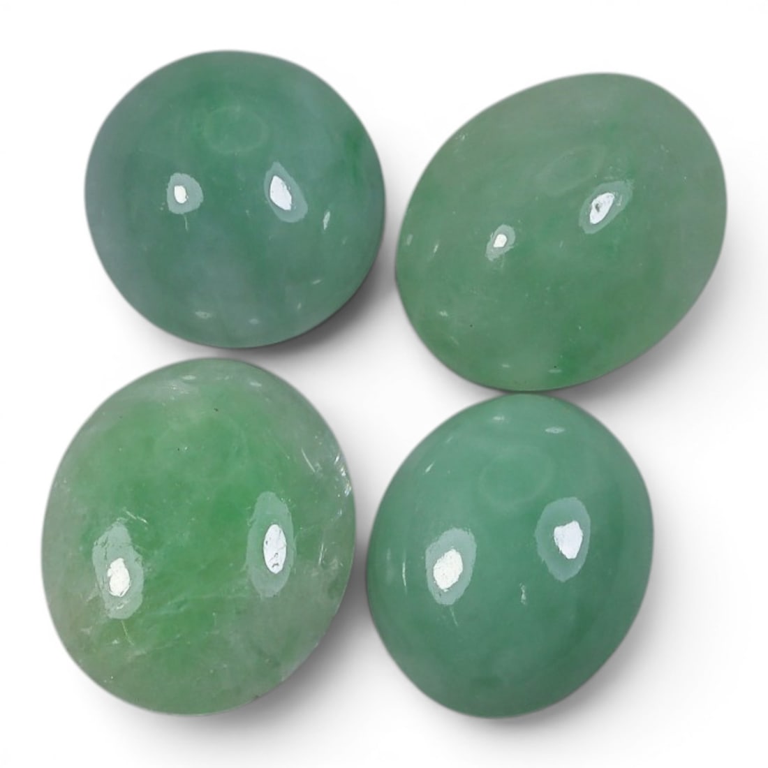 28.31 Carats Natural Type A Burmese Jadeite Cabochon Lot, 89AJ: Let me share with you this sweet parcel of four natural Type A Burmese jadeite cabochons, real earth-grown beauties right here! Look at that soft, even apple-green hue on all four stones, just like fr